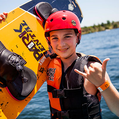 Boy Holding a Wakeboard